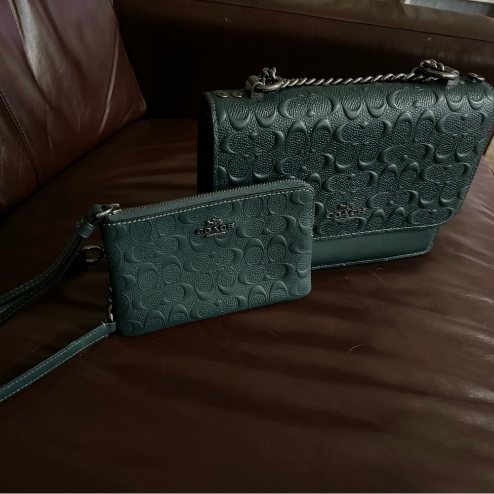Beautiful COACH Embossed Signature Crossbody with matching wristlet.
